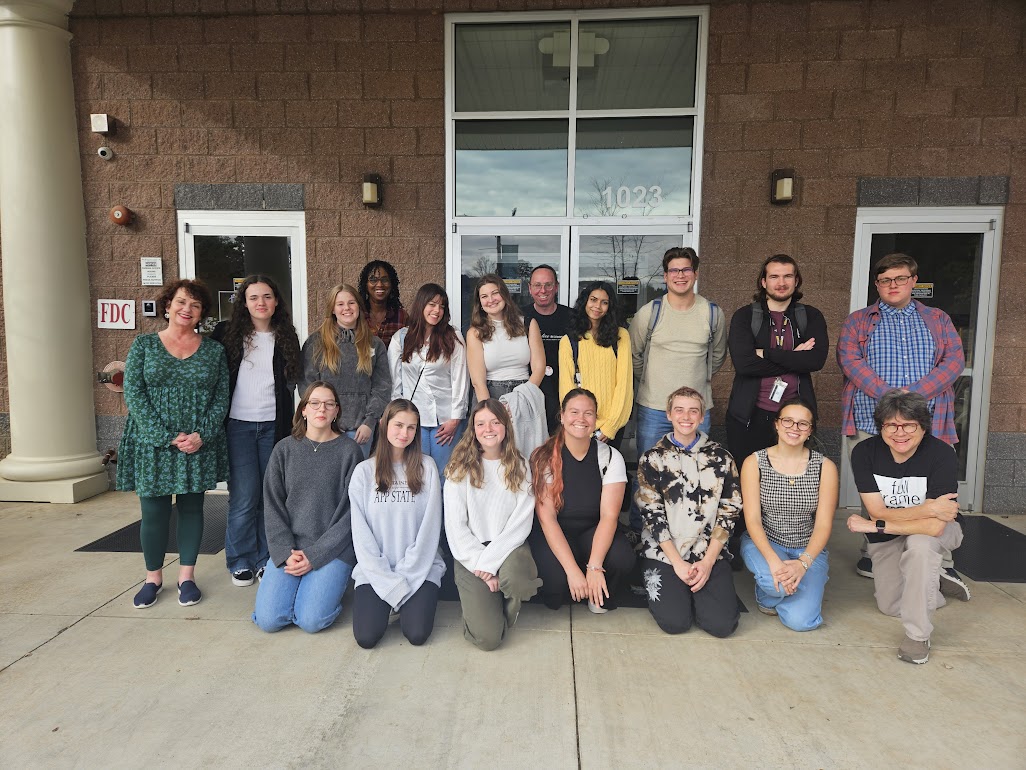 Group photo of Appalachian State University students and instructor Dr. Leslie D. McKesson. Seven people are kneeling in the front row. Nine students are standing in the middle row. Two staff are standing in the back row.